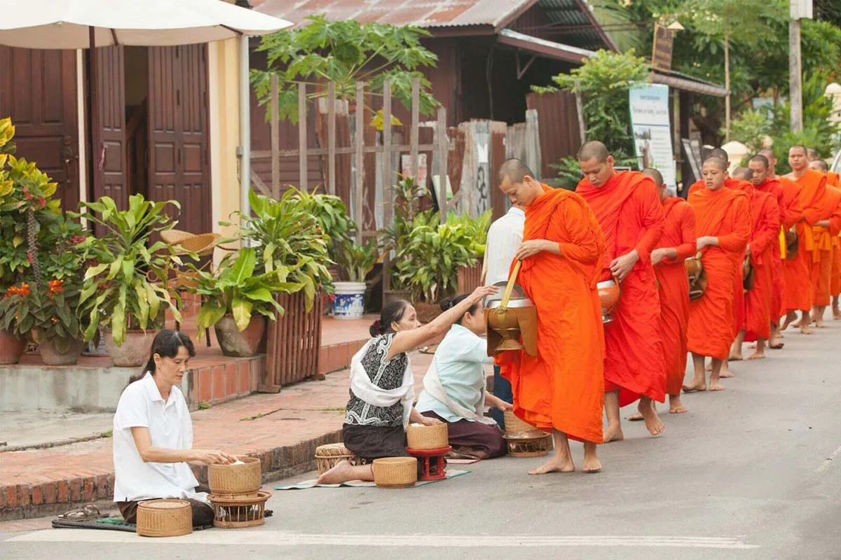 Tak Bat: Buddhist Almsgiving Ceremony in Thailand