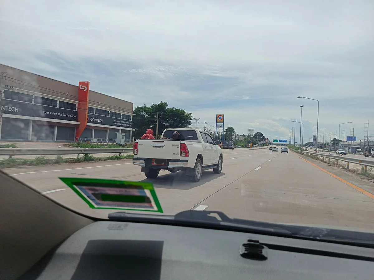 Passengers in the Back of Pickups in Thailand