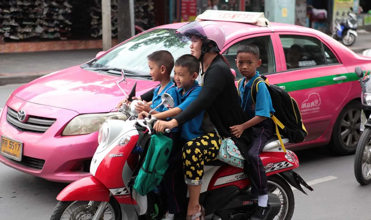 People on moped in Bangkok